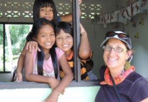 Volunteer with children at Burmese Learning Center