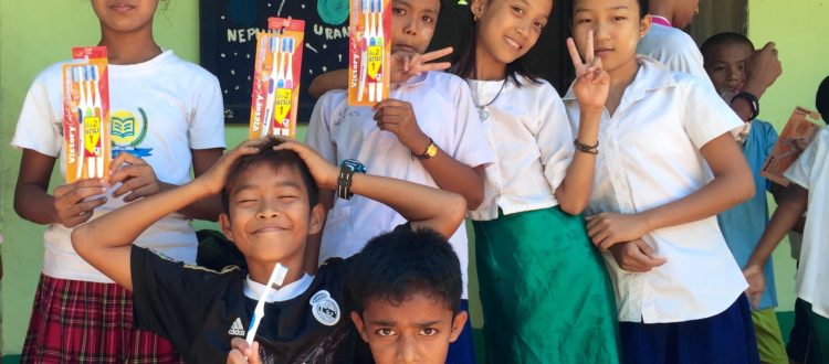 Students learning about dental hygiene at the Burmese Learning Center in Kuraburi