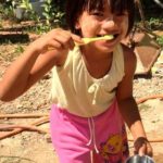 Student learning about dental hygiene at the Burmese Learning Center in Kuraburi