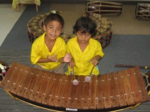 Children learning traditional Thai musical instrument - Andaman Discoveries