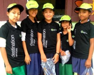 A group of children with new donated shirts and hats at the Migrant Education Program in Kuraburi Phang Nga
