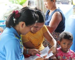 Parent, teacher & child at the Burmese Learning Center in Kuraburi