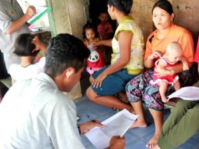 Burmese Learning Center Kuraburi - conducting a parent survey in the community