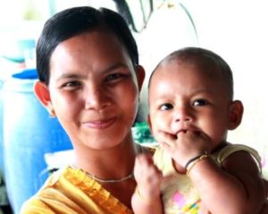 A Burmese Learning Center parent with her child, Kuraburi Thailand