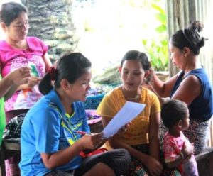 Parents, teacher & child at the Burmese Learning Center in Kuraburi