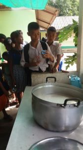 Students lining up for soy milk at the Burmese Learning Center in Kuraburi