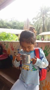 A student drinking soy milk at the Burmese Learning Center in Kuraburi