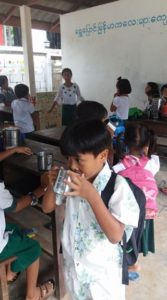 A child enjoying soy milk at the Burmese Learning Center in Kuraburi